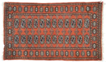 A Pakistan rug, 117 x 74cm, a Persian rug, 79 x 53cm and an Afghan rug, 69 x 50cm (3)
