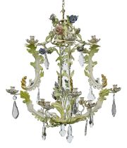 A naturalistic painted metal chandelier, late 20th c, of eight lights, issuing from leafy branches