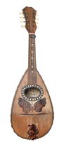 An eight string bowl back mandolin, early 20th c, inlaid with mother of pearl and tortoiseshell,