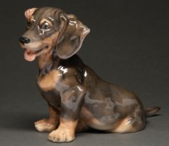 A Royal Copenhagen porcelain model of a Dachshund, 18cm h, painted and printed marks No cracks or