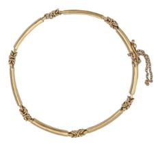 A gold bracelet, of seven curved links, 18cm l, apparently unmarked, 7.8g Slight wear consistent