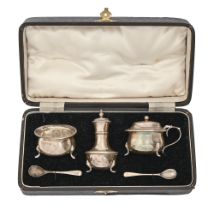 A George V three-piece silver condiment set, pepperette 85mm h, by J Gloster Ltd, Birmingham 1927,