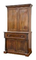 A Victorian mahogany secretaire-bookcase, the lower panelled doors flanked by turned pillar