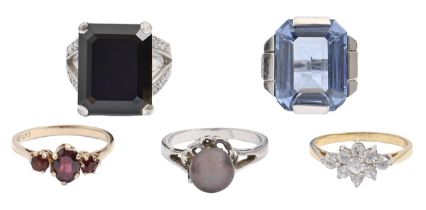 A garnet ring, in 9ct gold, London 1982, 2.2g, size N and four various other dress rings (5) The lot