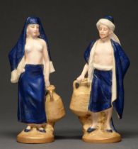 A pair of Royal Dux figures of Eastern water carriers, c1920, 19cm h, mark impressed on pink