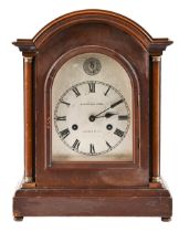 A Victorian inlaid mahogany arch top bracket clock, the silvered dial inscribed Hickleton & Sydal