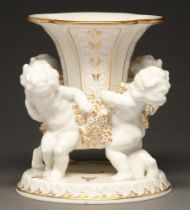 A Hutschenreuther gilt porcelain centrepiece, the detachable base supported by four children, mid