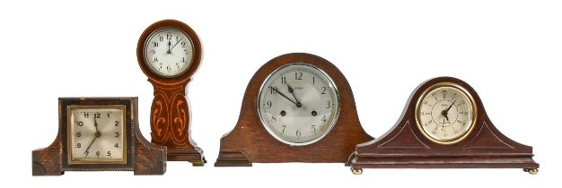 An Edwardian Art Nouveau inlaid mahogany balloon clock, with trench movement and enamel dial, 29cm h