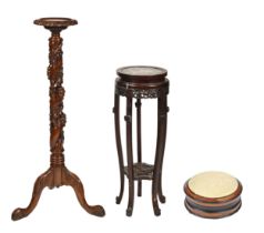 A Chinese carved hardwood jardiniere stand, with stone inset top and a carved wood torchere, 108cm