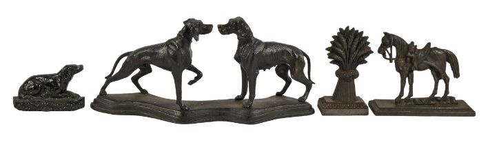 A cast iron sculpture of a dog and bitch, 22cm h; 48cm w and two Victorian cast iron dog and