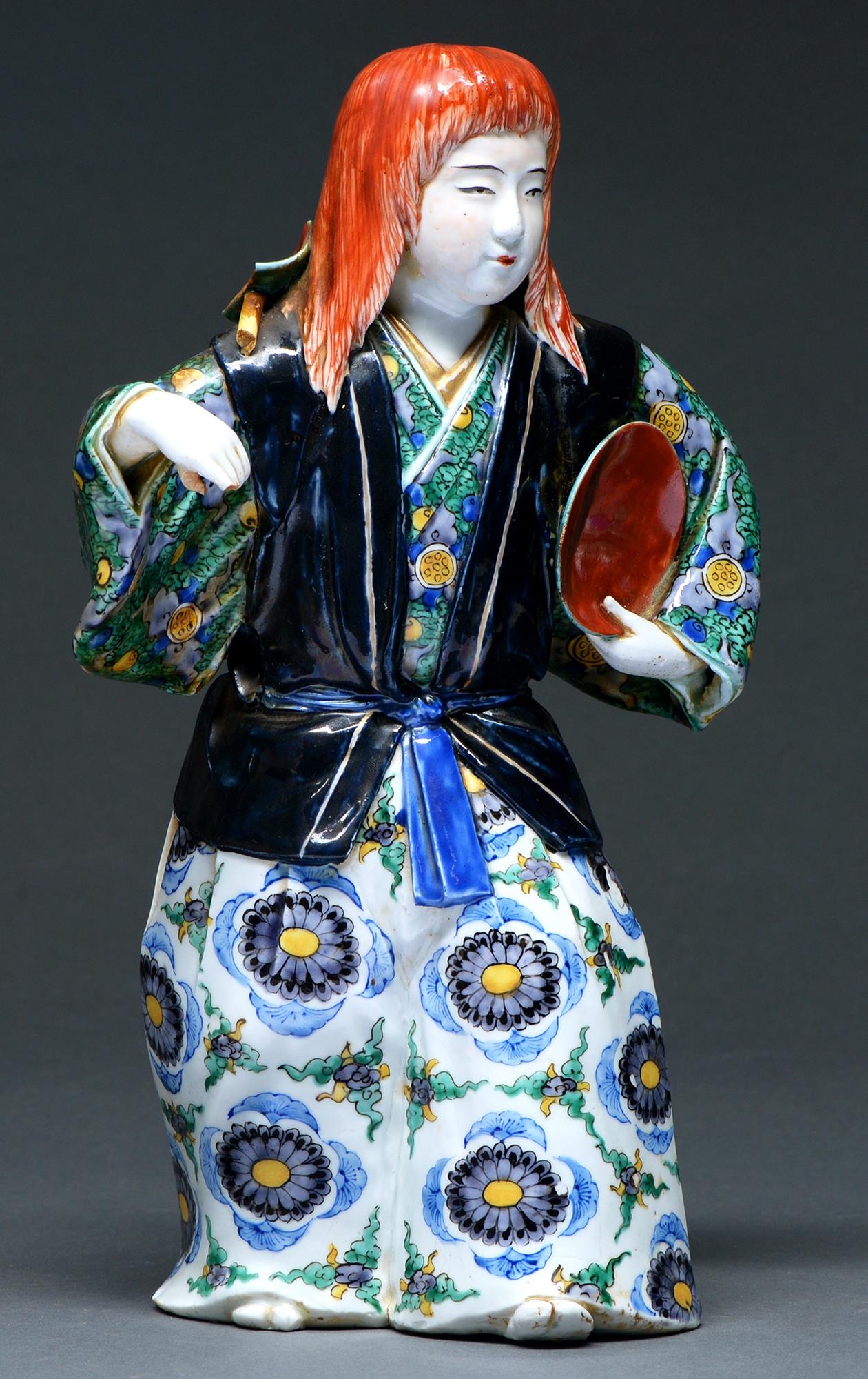 A Chinese famille rose figure of an immortal, 20th c,  in green and lavender robe, 24cm h, impressed - Image 2 of 3