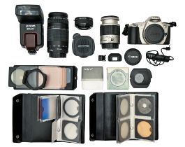 A Canon EOS 300, a Canon zoom lens 75-300mm, a Canon Ultrasonic 28-90mm, a Komura lens extender,