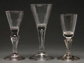 A wine glass, 19th c, the conical bowl on solid stem with long tier, folded foot, 15.5cm h and two