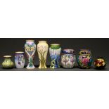 Two Moorcroft enamelled ginger jars and covers and five vases, 10.5cm h and smaller and a
