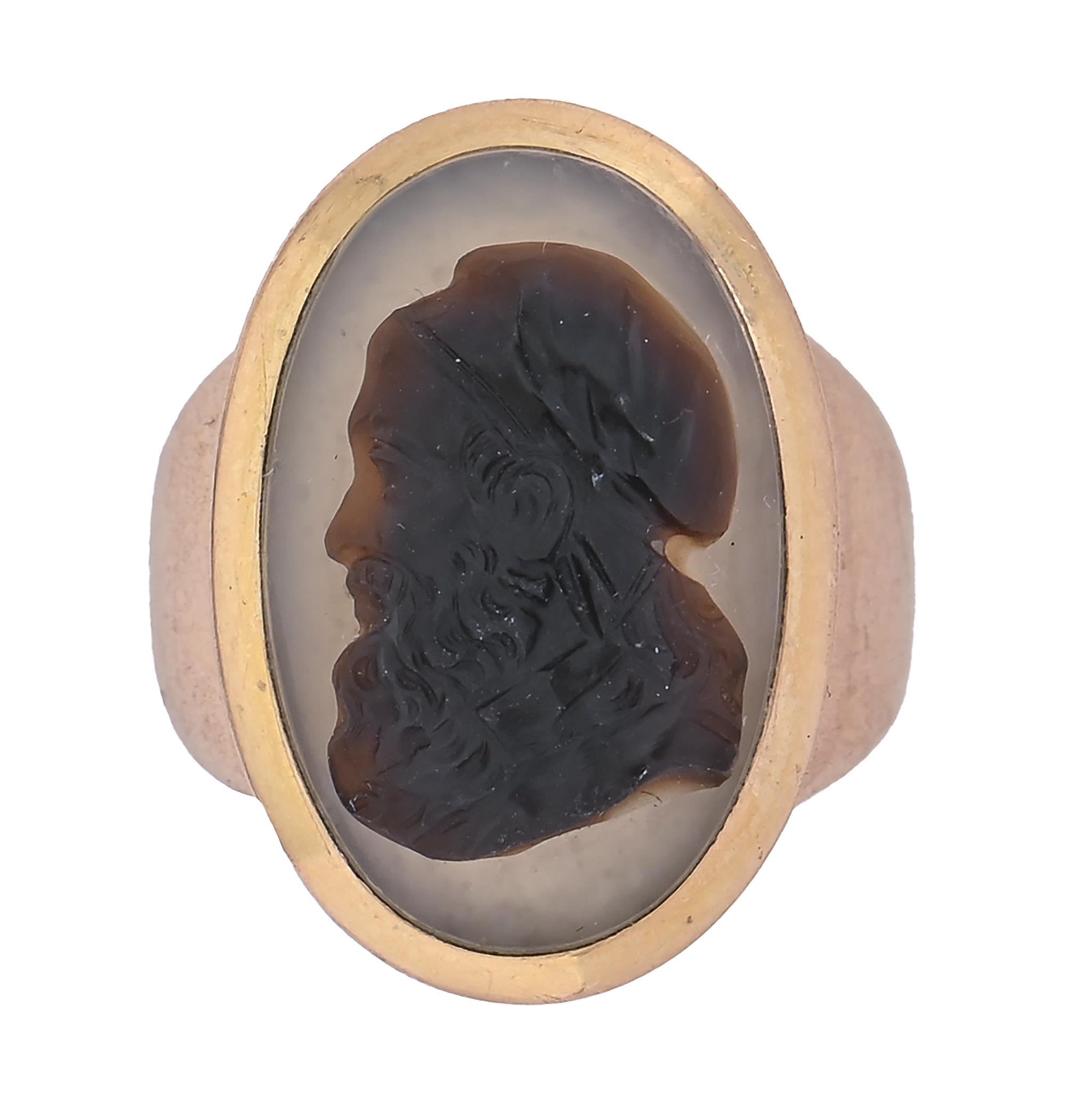 A gold and agate cameo ring, in the neo classical taste, 19th c, the oval hardstone carved with a