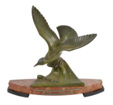 An Art Deco bronzed spelter sculpture of a seabird in flight, on marble base, 41cm h; 46cm w