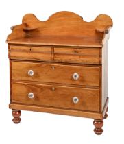 An Edwardian mahogany dressing chest, with gallery top, the drawers fitted with moulded glass knobs,