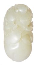 A Chinese jade pebble carving of fruit and leaves, 61mm l Good condition