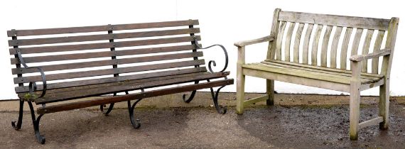 A teak garden seat, 124cm w and a wrought iron and timber garden bench, 180cm w Timber on wrought