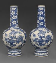 A pair of Chinese blue and white vases, 19th c, painted with auspicious objects reserved on a