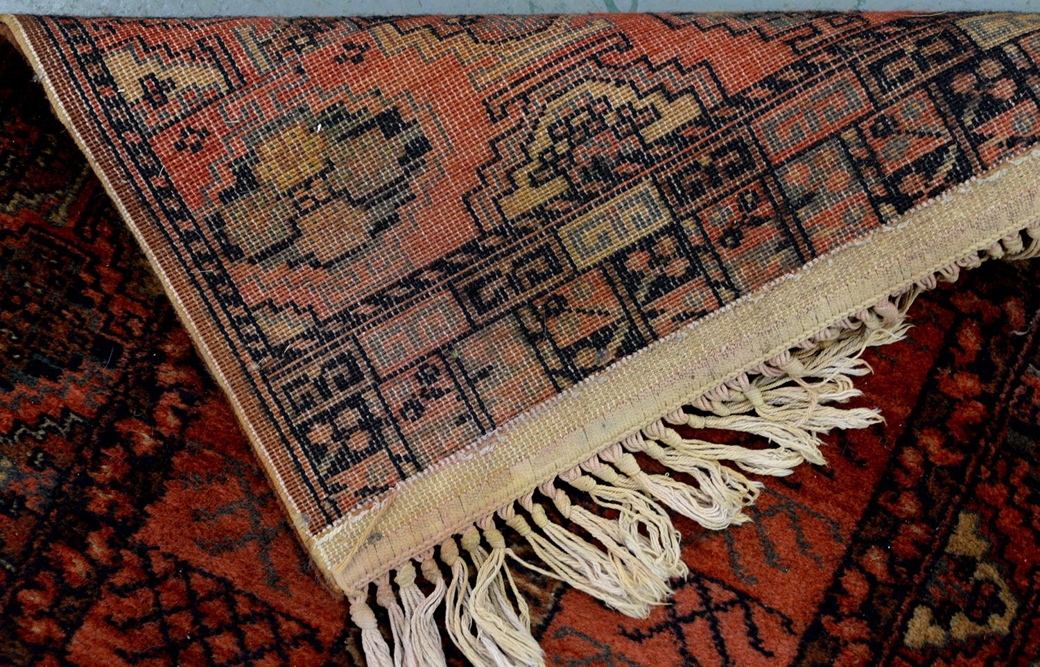 A Persian rug, 228 x 136cm and two runners, 294 x 102cm and smaller - Image 16 of 23