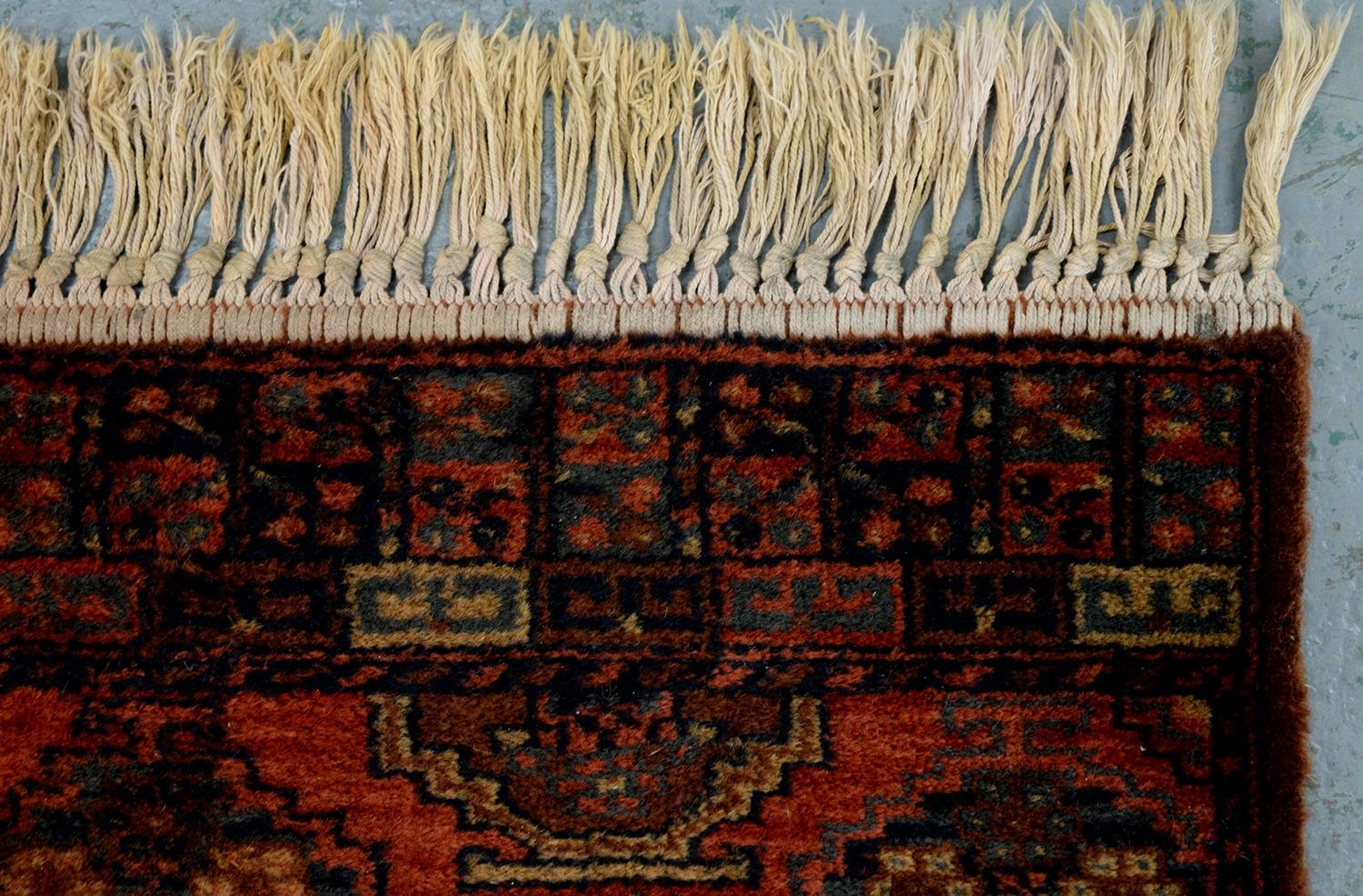 A Persian rug, 228 x 136cm and two runners, 294 x 102cm and smaller - Image 12 of 23