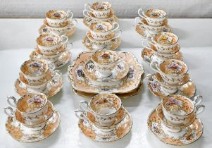 A Coalport tea and coffee service, c1840, painted with a central rose and panels of flowers reserved