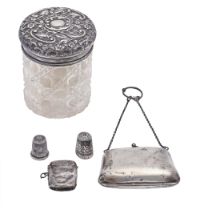 An Edwardian cut glass powder jar with silver lid, Birmingham 1902, a silver vesta, Birmingham 1911,