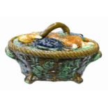 A reproduction majolica game pie dish and cover