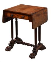 A Victorian mahogany drop leaf work table, on four reeded pillars, carved stretcher base and claw