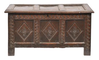 An 18th c carved and panelled oak blanket box, the interior with a till, 65cm h; 121 x 53cm Panelled