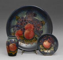 A Moorcroft Finches plate, dish and vase designed by Sally Tuffin, 1988, plate 25.5cm diam,