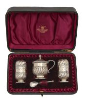 A Victorian silver wrythen fluted condiment set, pepperette 62mm h, by Horace Woodward & Co,