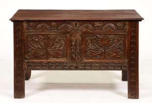 A Charles II carved oak blanket box, with later boarded lid, 73cm h; 115 x 53cm Some staining from