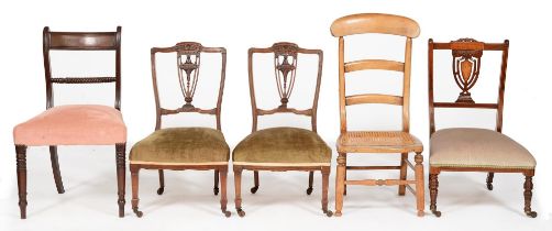 A pair of Victorian carved walnut salon chairs, on square tapering legs and pottery castors, similar