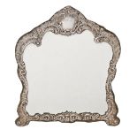 An Edwardian rococo revival silver dressing mirror, with bevelled plate, 34cm h, by Henry