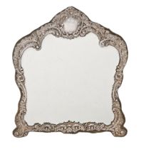 An Edwardian rococo revival silver dressing mirror, with bevelled plate, 34cm h, by Henry