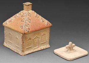 An English saltglazed brown stoneware cottage tobacco box, cover and unglazed weight,