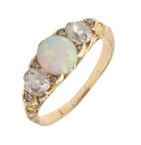 An opal and diamond ring, c1900, with old cut diamonds, in gold, 4.9g, size P Opal polish scratched,