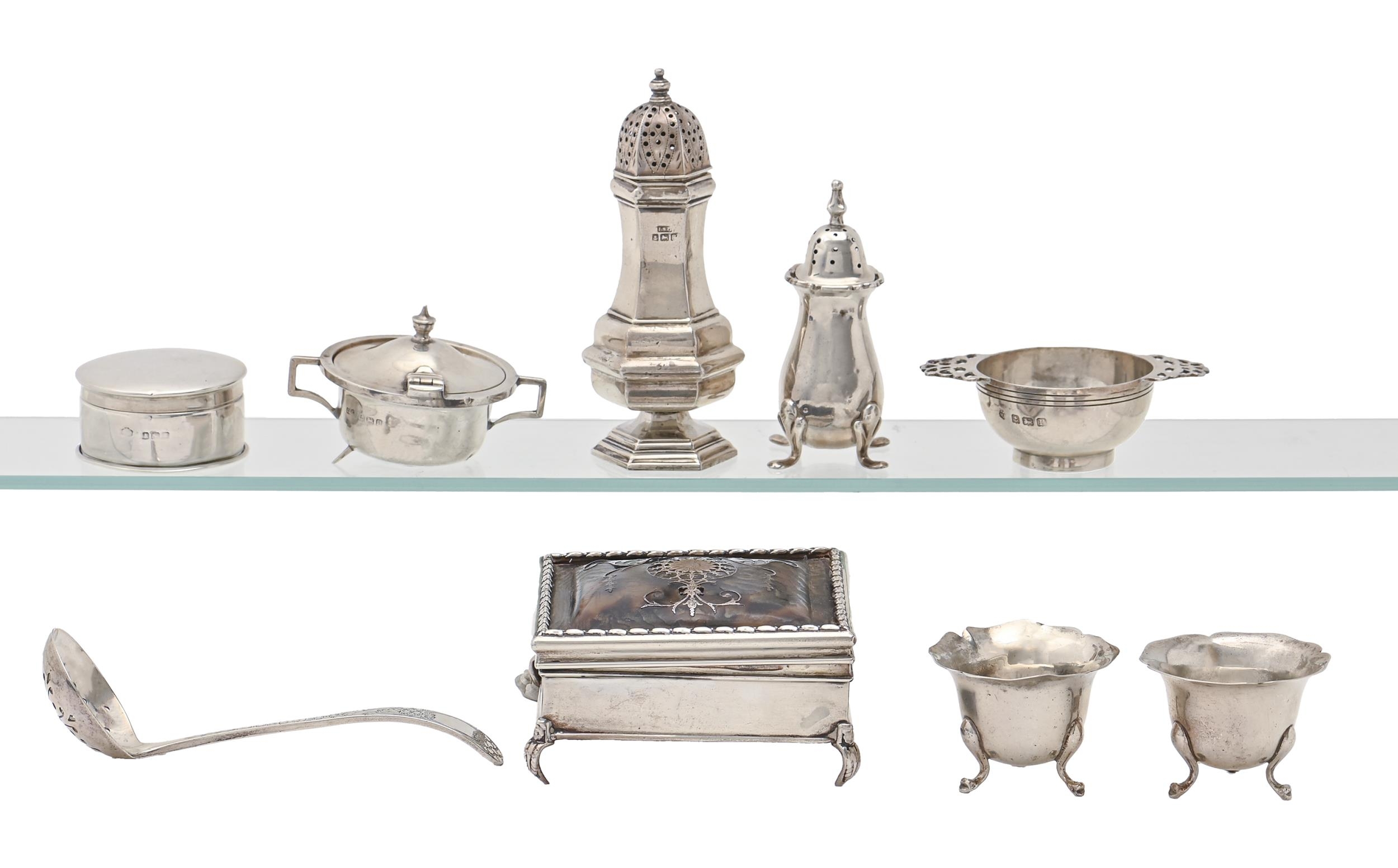 A George V miniature silver quaich, three and a pair of contemporary silver condiments, a silver