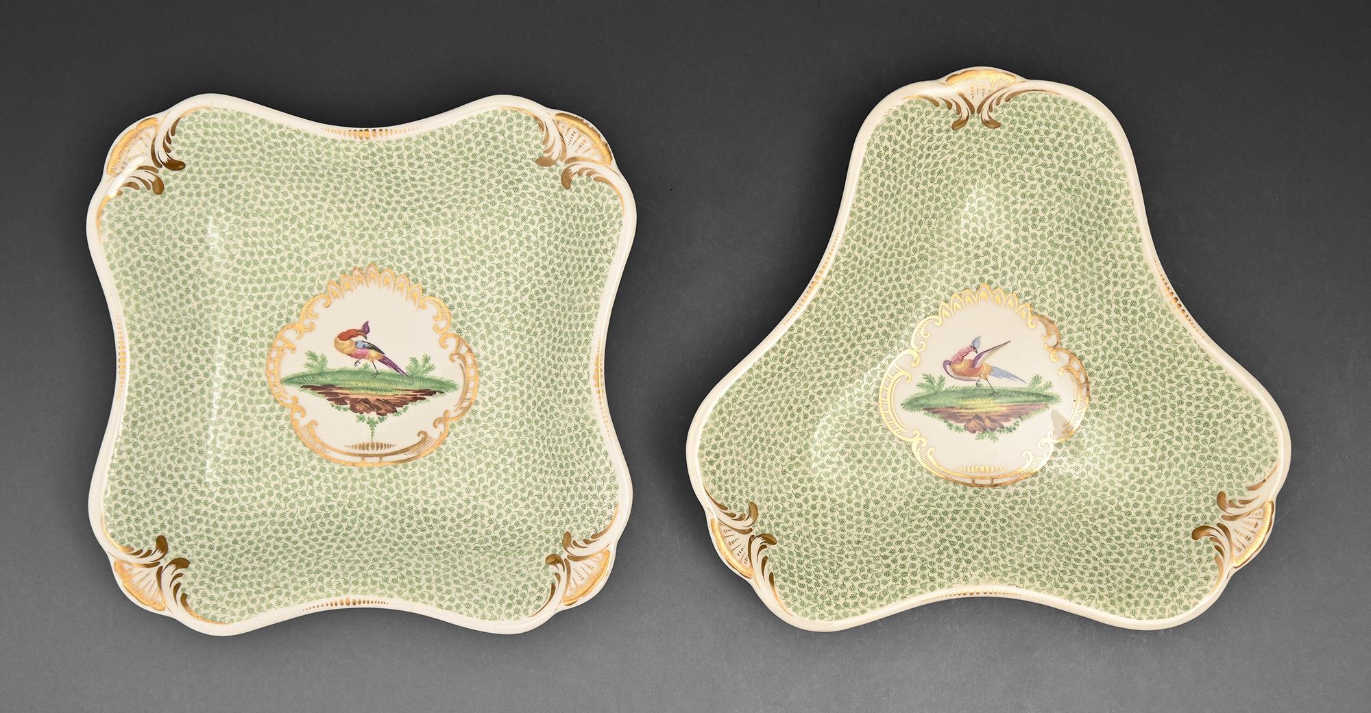 Two Rockingham dessert dishes, c1830-1835, painted with a bird in green blackberry border, 21.5