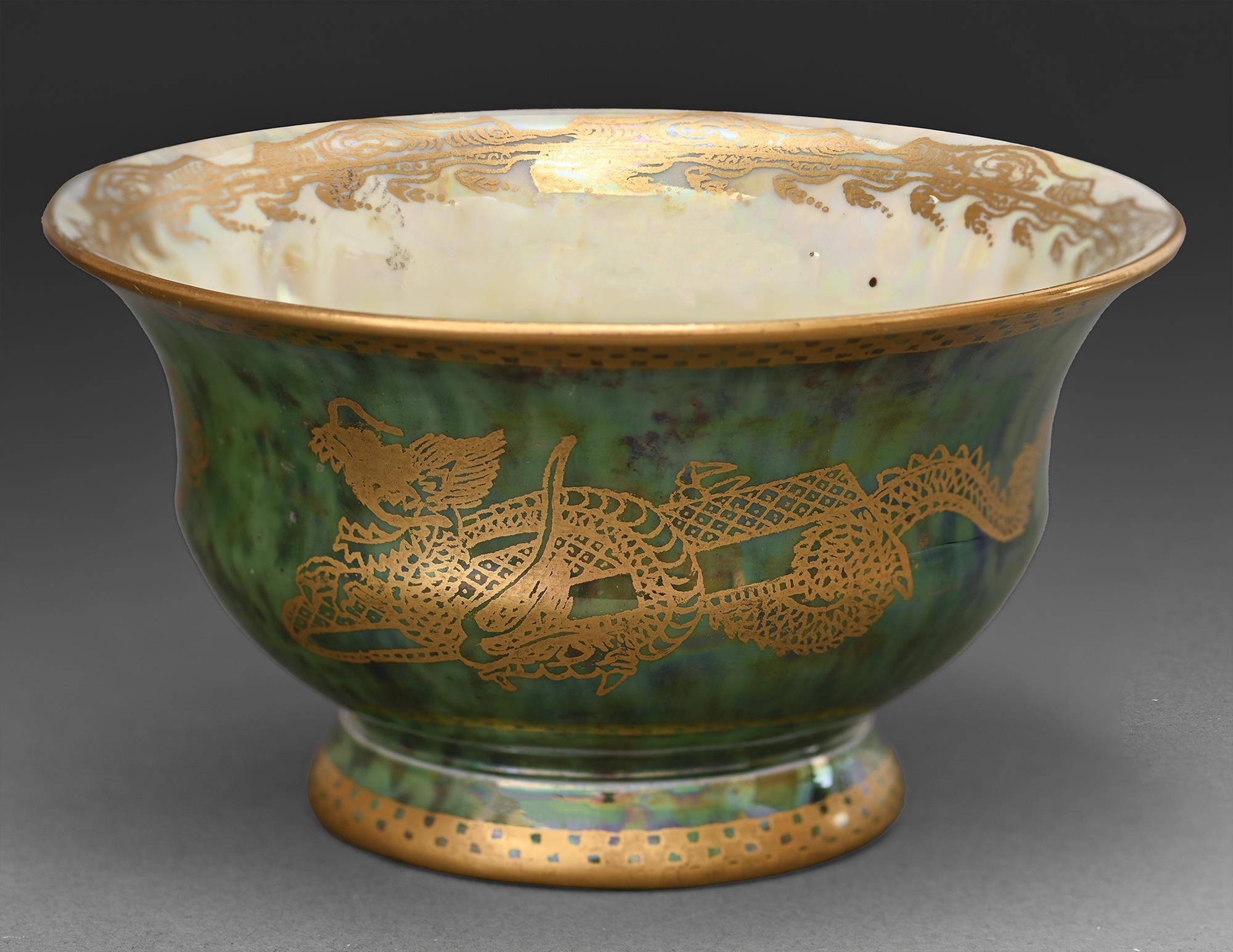 A Wedgwood green ground Dragon Lustre cup, designed by Daisy Makeig Jones, c1920, 11.5cm diam,