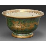 A Wedgwood green ground Dragon Lustre cup, designed by Daisy Makeig Jones, c1920, 11.5cm diam,