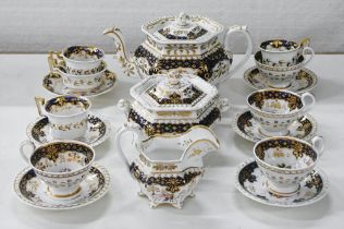 A John Ridgway bone china tea service and trio, c1825, painted with loose bouquets in cobalt and