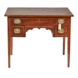 A George III mahogany and line inlaid lowboy, with shaped apron, on square tapered legs, 71cm h;