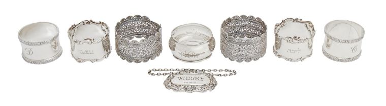 Two pairs of Edwardian and Elizabeth II silver napkin rings, one other, a pair of Continental silver