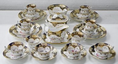 A Staffordshire bone china tea and coffee service, c1820, painted with colourful bouquets in