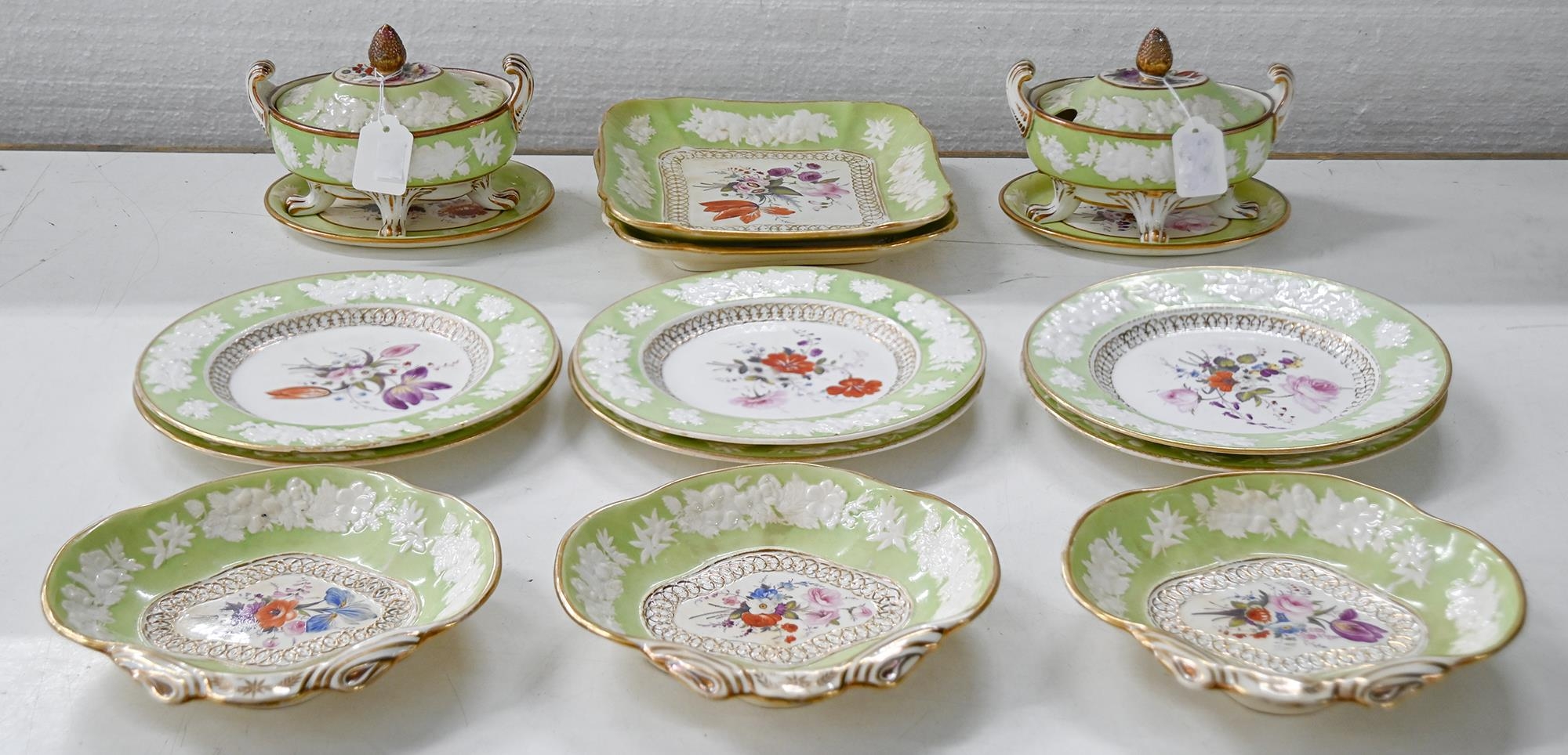 An English porcelain dessert service, possibly Grainger Worcester, c1820, painted with a central