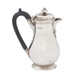 A George V silver lidded jug, of oval section, 19cm h, by C S Harris & Sons Ltd, London 1914,