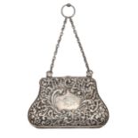 An Edwardian silver bag, die stamped with flowers, scrolls and trellis, chain handle, 12.5cm l, by